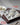 SS 304 idli mold tray with idlis on a gray surface