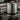 Stainless steel full height cookpot on a induction stove with kitchen background