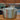 Stainless steel cookpot with lid on a wooden surface
