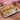 Hammered stainless steel partition thali served with Indian meal — rice, dal, curry, and roti