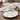 Dining table setting with a matte finish round plate.